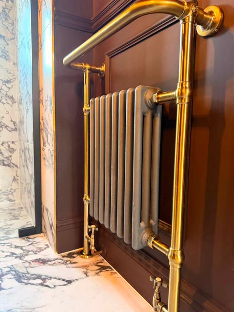 Walk-in wet room with marble-effect tiling and brass fittings, Burscough